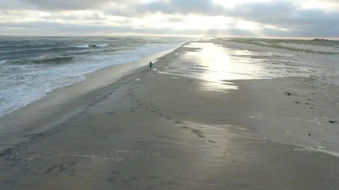 Man Running On Ocean Beach, Look at Smart Watch Stock Footage 101855612