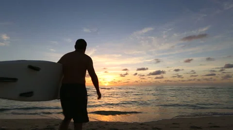Man Running into Ocean with Surfboard Stock Footage 41793150