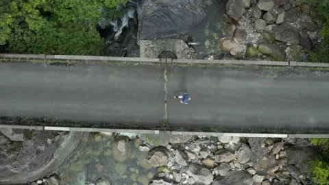 Man Running Over Bridge in Forest, Top Down Aerial View Stock Footage 152494564