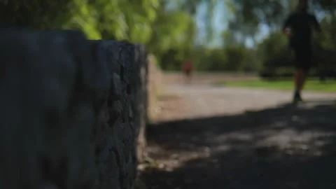 Man running in the park on a blurred background. Slow Motions. 4K Stock Footage 287588110