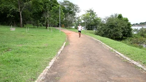 Man Running at Park Stock Footage 103280185