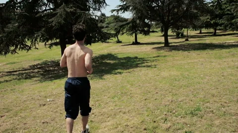 Man running in a park, jogging,steadycam 스톡 동영상 41761469
