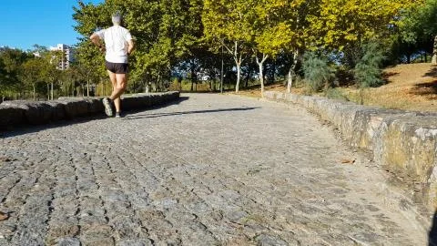 Man running on the park Stock Photos