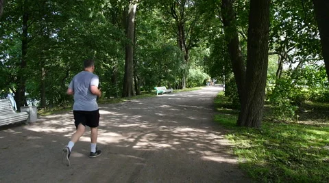 Man running in the park. slow motion Stock-Footage 65413119