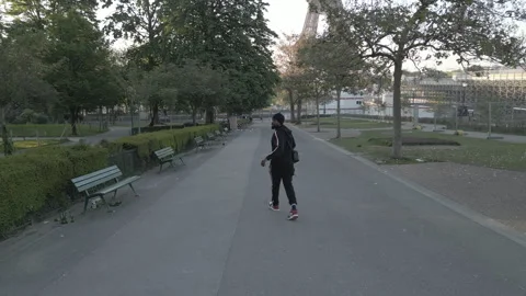 Man running past Eiffel Tower Stock Footage 274913010
