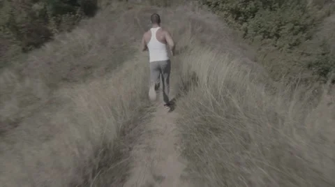 Man Running On Path (BMCC 2.5K - 2400x1350) Stock Footage 47957770