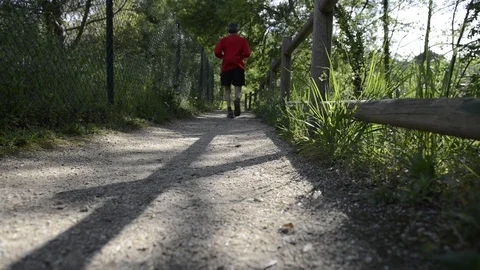 Man running on a path of ground Video stock 129316287