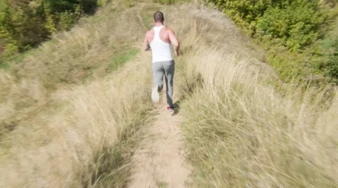 Man Running On Path. Steadicam shot (BMCC 2.5K - 2400x1350) Stock Footage 47941258
