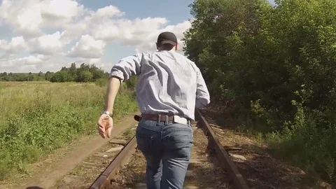 Man running on railroad tracks Video stock 79028481