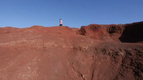 Man running on red sand Stock Footage 247915223