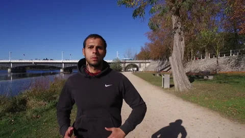 Man running by river slow motion Stock Footage 144814931
