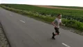 The man running on a road on a field background. slow motion HD Footage
