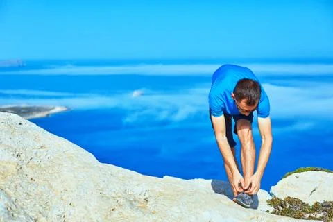 Man running on the rock Stock Photos
