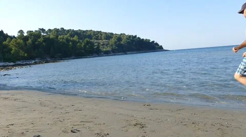 Man Running on Sandy Beach - Slow Motino Stock Footage 54915868