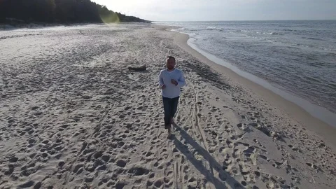 Man running by a sea Stock Footage 70350769