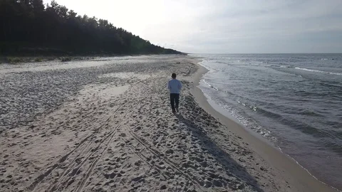 Man running by a sea Stock Footage 70350802