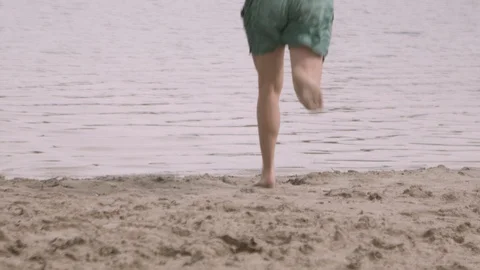 Man Running Into Sea Stock Footage 127036077