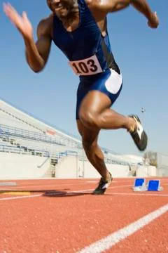 Man Running From Starting Block Stock Photos