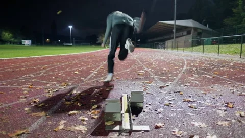 Man running with starting blocks Stock Footage 289290544