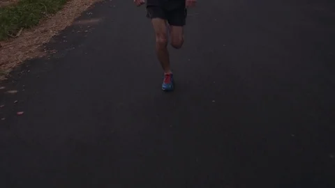 Man Running at Sunset (Pan up) Stock Footage 81529965