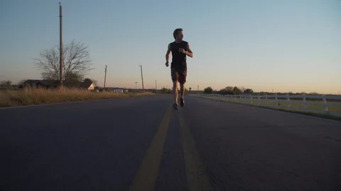 Man Running At Sunset3 Stock Footage 92415844
