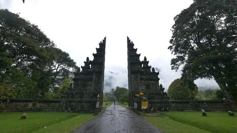 Man running through Candi Bentar gateway in asia, slow motion Stock Footage 85618296