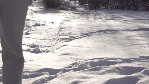 Man is running through the deep snow ,slow mo Stock Footage 84256682