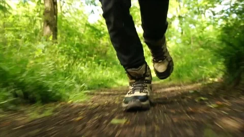 Man Running through Nature. Low Angle Boots Running through Forest Woodland Stock Footage 111236752