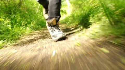 Man Running through Nature. Low Angle Boots Running through Forest Woodland Stock Footage 111236825
