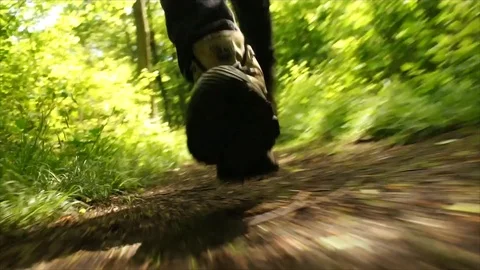 Man Running through Nature. Low Angle Boots Running through Forest Woodland Stock Footage 111236858