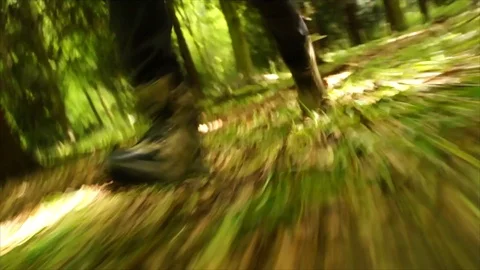 Man Running through Nature. Low Angle Boots Running through Forest Woodland Stock Footage 111236873