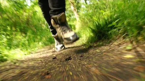 Man Running through Nature. Low Angle Boots Running through Forest Woodland Stock Footage 111236876