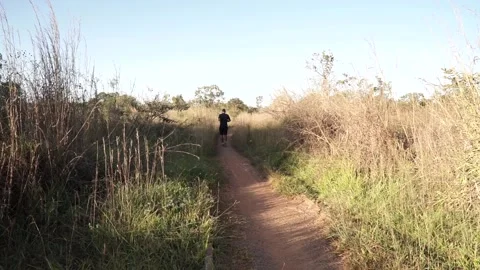 Man Running Through Park Stock Footage 134838845