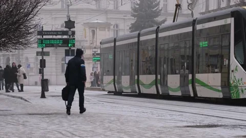 A man running through the street to catch the tram Stock Footage 170178820