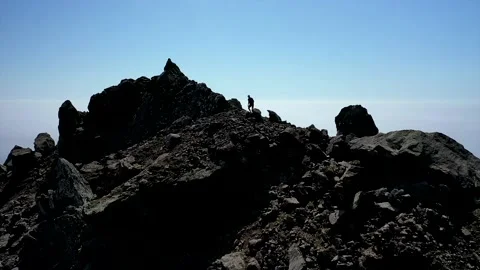 Man running on top of a mountain Stock Footage 156655795