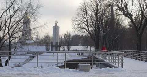 Man is Running Toward And Skating by Ice Twice Snow Frosty Winter Man in Red Stock Footage 58820892