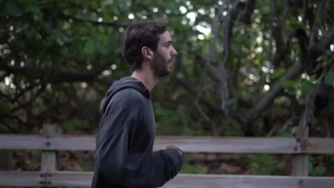 Man running tracking shot Vídeo Stock 243518835