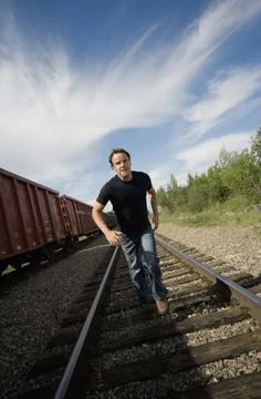 Man Running On Train Tracks Stock Photos
