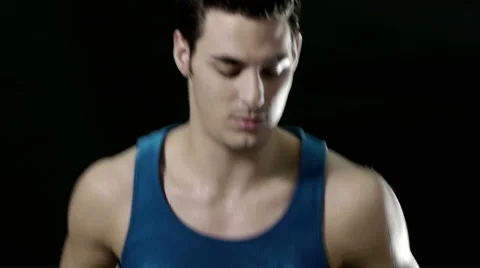 Man running on treadmill on black background Stock Footage 1091269