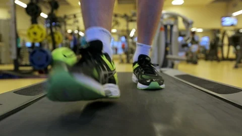 Man running on a treadmill. Close-up shot.  스톡 동영상 85705665