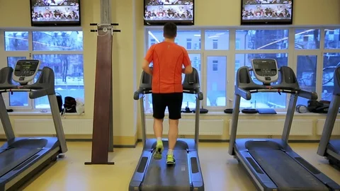 Man running on a treadmill Stock Footage 85705693