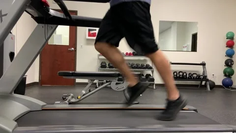 Man running on a treadmill Stock Footage 200798787