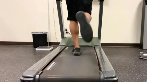 Man running on a treadmill Stock Footage 200798804