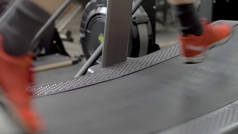 Man running on treadmill at gym with red sneakers Stock Footage 112891444
