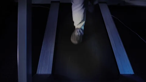 A man running on a treadmill while working out in a a gym. Stock Footage 101732323