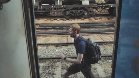 Man running trying to enter train Stock Footage 109421649