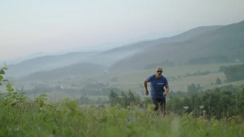 Man Running Uphill  Stock Footage 93660831