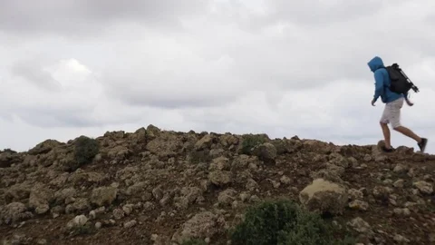 Man running on volcanic landscape Video stock 71552666