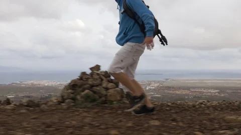 Man running on the volcanic landscape Stock Footage 71553090