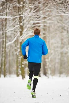 Man running in winter Stock Photos